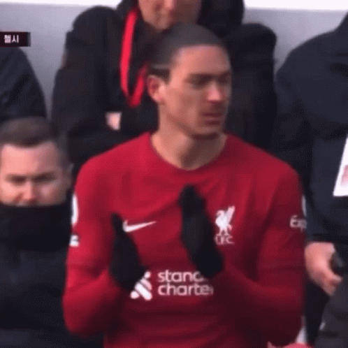 Man in Red Shirt Saying Stand Charter