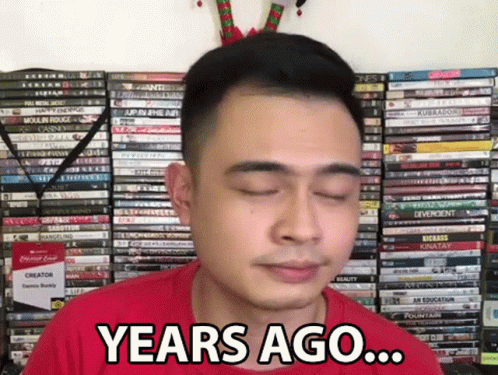 Man in Red Shirt Saying Years Ago in Front of DVDs