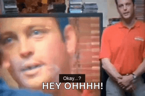 Man in Red Shirt Says Okay at Screen with Face