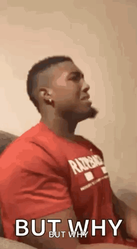 Man in Red Shirt Sitting on Couch Talking