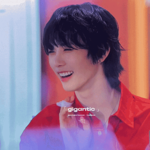 Man in Red Shirt Smiling Gigantic