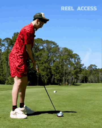 Man In Red Shirt Swinging Golf Club GIF