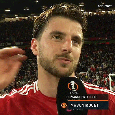 Man in Red Shirt Talking Into Microphone Mason Mount