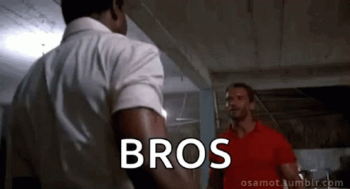 Man In Red Shirt Talking To White Shirt GIF
