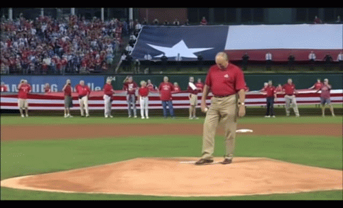 Man in Red Shirt Throwing Baseball