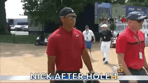 Man In Red Shirt Walking Golf Course GIF