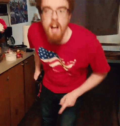 Man In Red Shirt With American Flag GIF