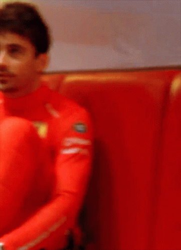 Man in Red Shirt with Ferrari Logo