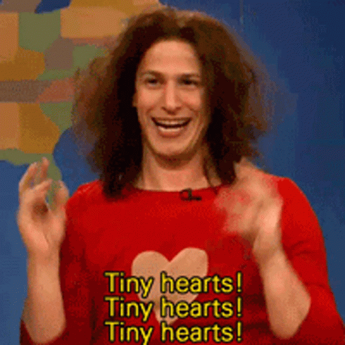 Man in Red Shirt With Heart Says Tiny Hearts Tiny Hearts Tiny Hearts