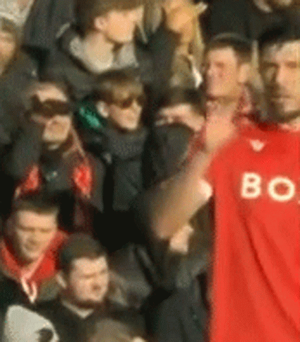 Man in Red Shirt With Letter B
