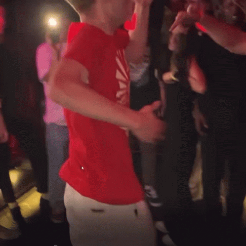 Man in Red Shirt With Sun Dancing