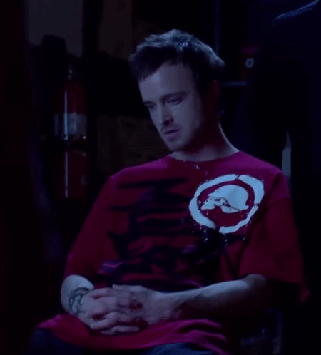 Man In Red Shirt With White Circle GIF