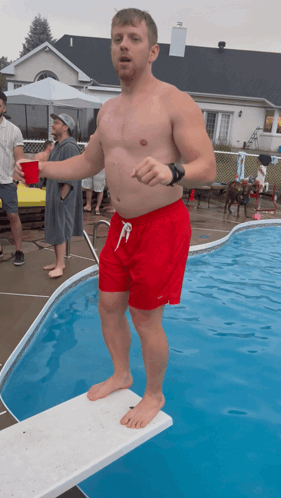 Man in Red Shorts on Diving Board