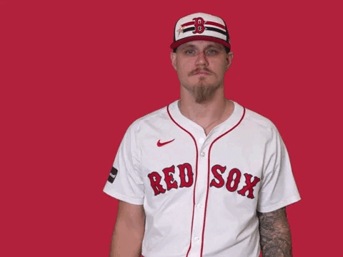 Man in Red Sox Jersey Pointing Up
