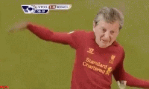 Man in Red Standard Chartered Jersey Dancing