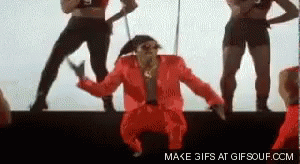 Man in Red Suit Dancing on Stage