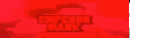 Man in Red Suit Holding Emperor Nark Sign