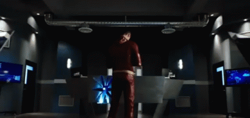Man in Red Suit in Dark Room