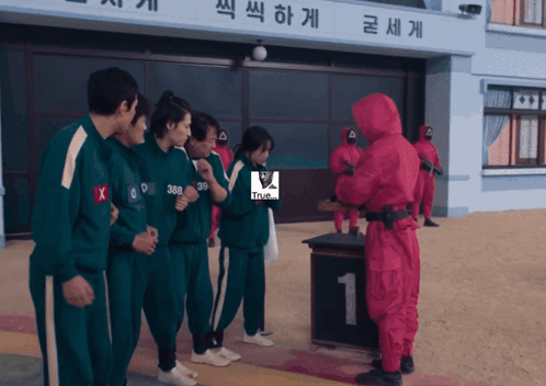 Man in Red Suit With Green Uniforms