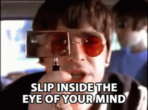 Man In Red Sunglasses Holding Camera Saying Slip Inside The Eye Of Your Mind