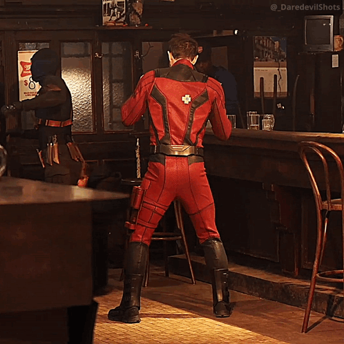 Man In Red Superhero Costume Dancing GIF