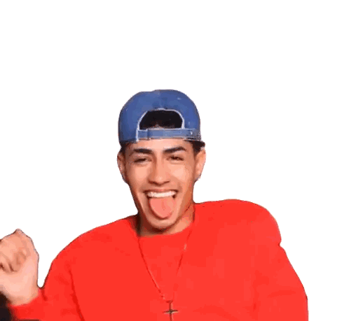 Man in Red Sweater and Blue Hat Sticking Tongue Out