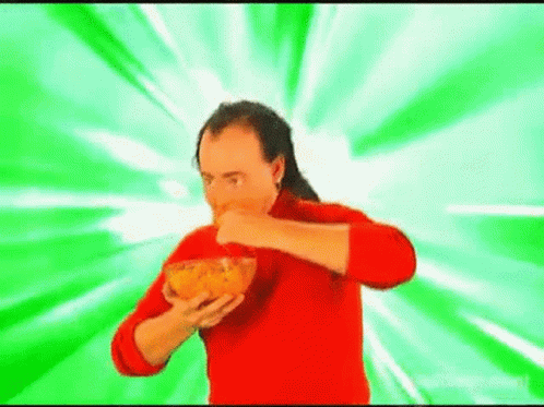 Man in Red Sweater Eating Chips