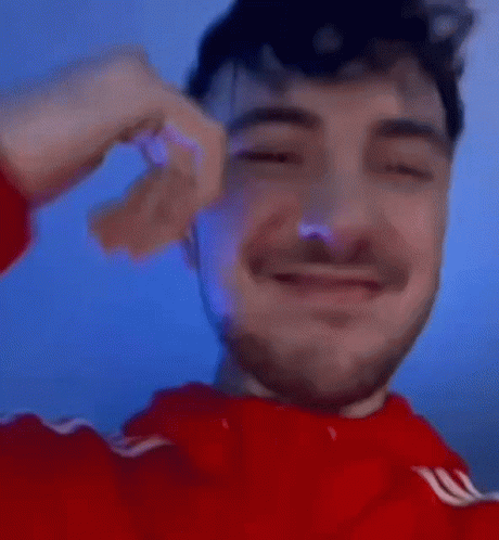 Man in Red Sweater Giving Thumbs Up