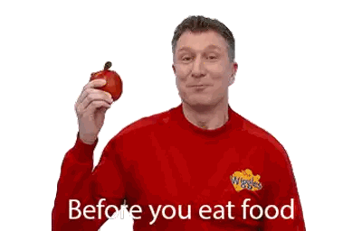 Man in Red Sweater Holding Apple