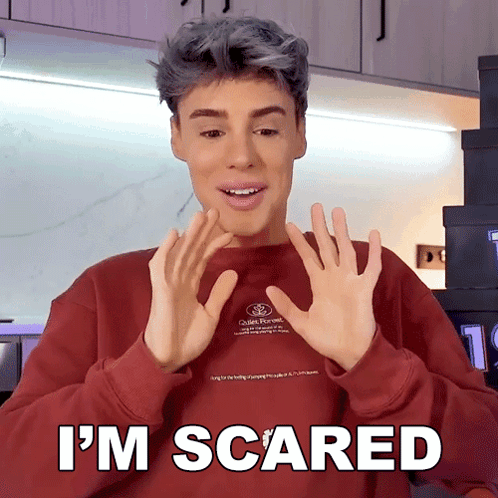 Man in Red Sweater Saying Im Scared