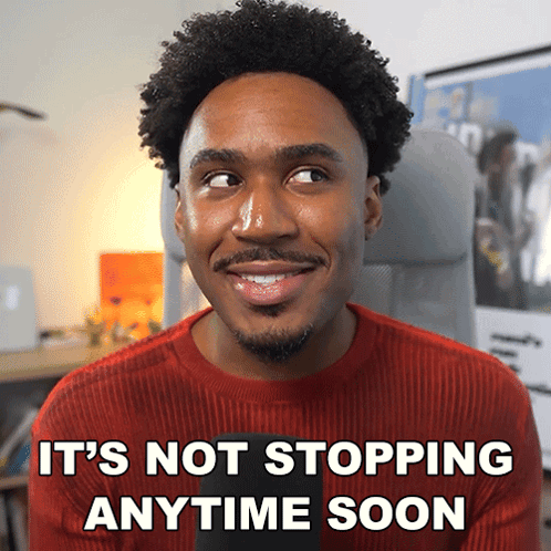 Man In Red Sweater Smiling It's Not Stopping Anytime Soon GIF