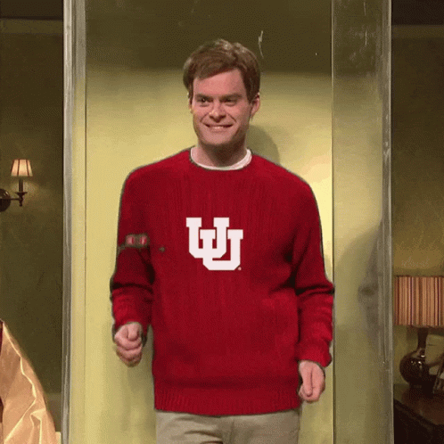 Man in Red Sweater With White Letter U