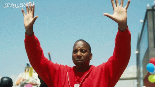 Man in Red Sweatshirt Raising Hands Bitplayas