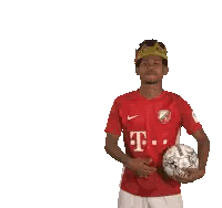 Man in Red T-Mobile Jersey Holding Soccer Ball