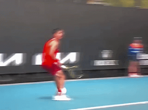Man In Red Tank Top Holding Tennis Racquet GIF