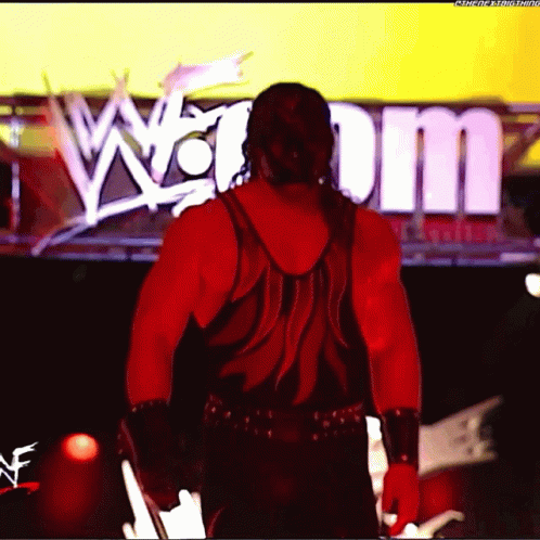 Man In Red Tank Top In Front Of Sign Saying W GIF