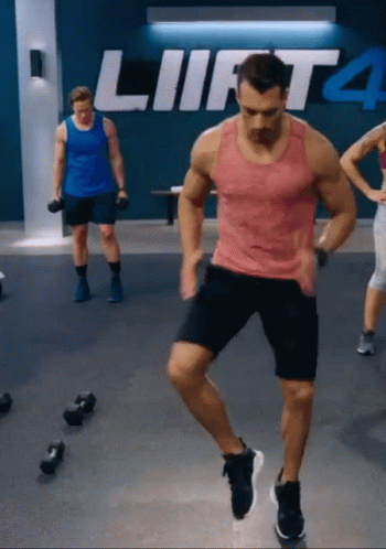Man In Red Tank Top Jumping Lift 4 GIF
