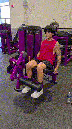 Man in Red Tank Top on Purple Machine