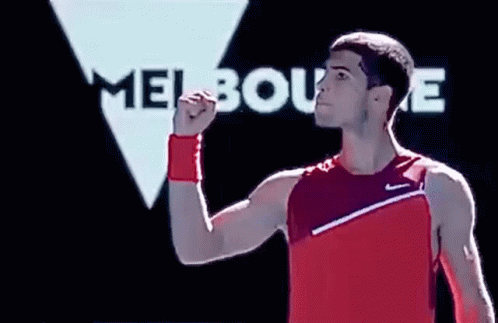 Man In Red Tank Top Raising Fist Melbourne Sign GIF