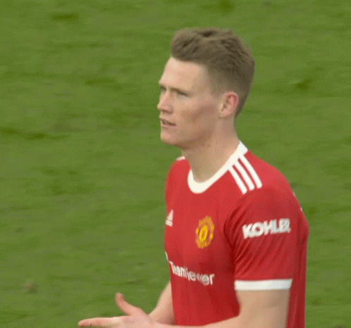 Man in Red TeamViewer Jersey on Soccer Field
