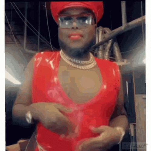 Man in Red Top, Red Hat, and Glasses