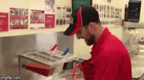 Man in Red Uniform Cooking