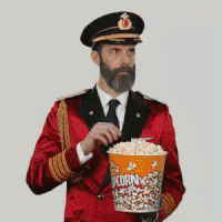Man In Red Uniform Holding Popcorn Bucket GIF