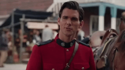 Man in Red Uniform Talking to Horse