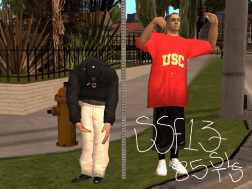 Man in Red USC Shirt Next to Man in Black Hat