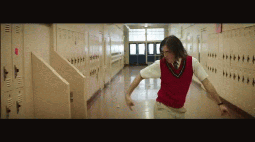 Man in Red Vest and Tie Walking