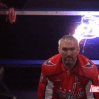 Man in Red Washington Capitals Jacket Locker Room