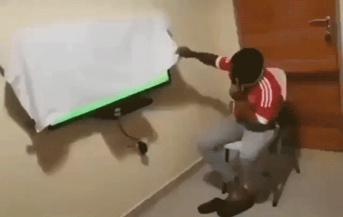 Man In Red White Adidas Shirt Watching TV GIF