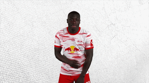 Man in Red White and Blue Shirt With Red Bull