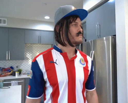 Man In Red White And Blue Striped Shirt With Puma Logo GIF